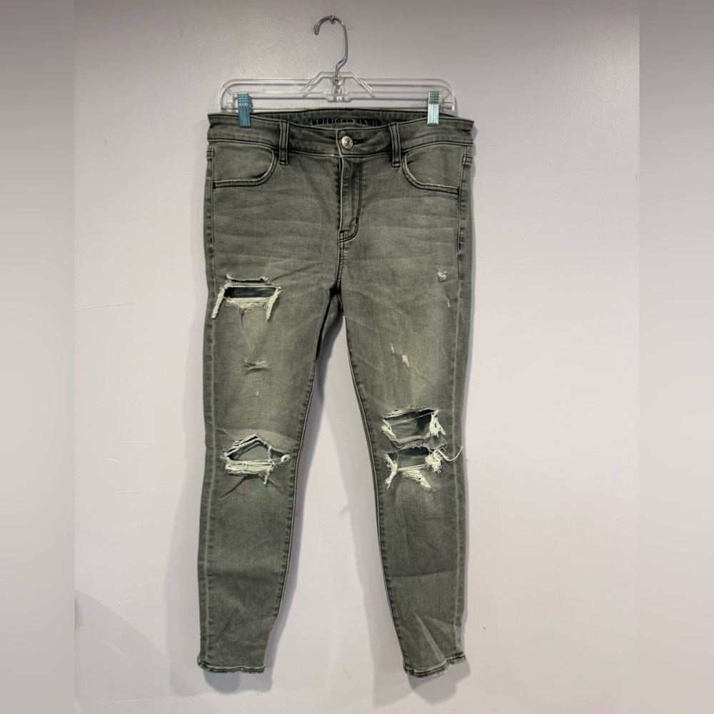Grey American Eagle next level stretch distressed skinny jeans